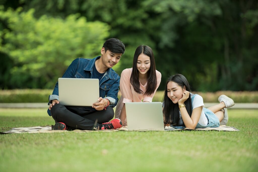 students computers laptops smiling 1807505